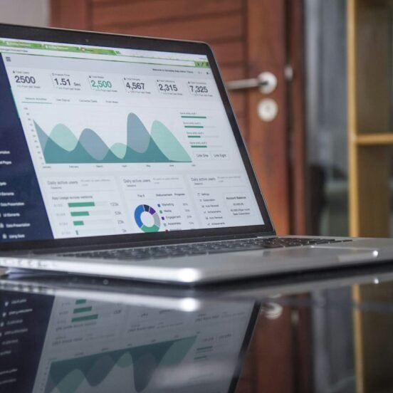 Analytics dashboard on a laptop displaying sales metrics and KPI charts, representing pharma field force effectiveness measurement