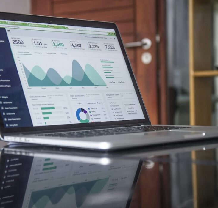 Analytics dashboard on a laptop displaying sales metrics and KPI charts, representing pharma field force effectiveness measurement