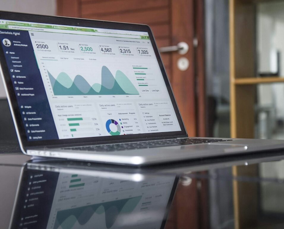Analytics dashboard on a laptop displaying sales metrics and KPI charts, representing pharma field force effectiveness measurement