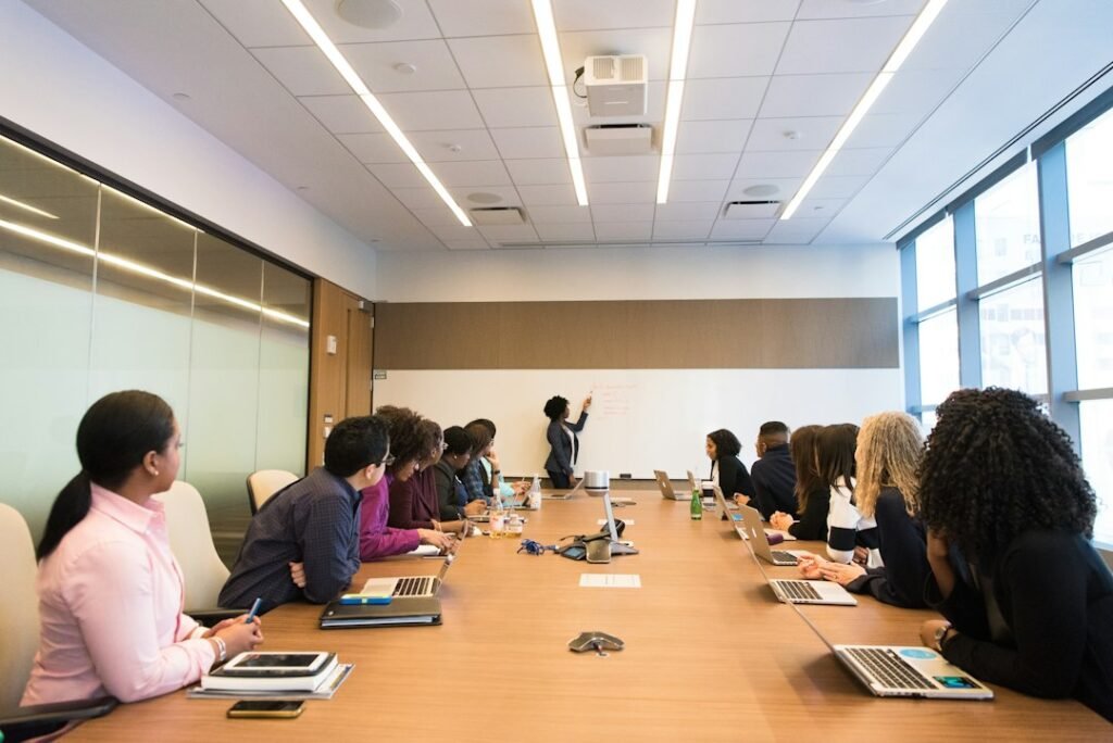 Pharma Brand Manager Roles & Responsibilities India 4 Senior pharma marketing leader presenting strategy to a large cross-functional team in a conference room
