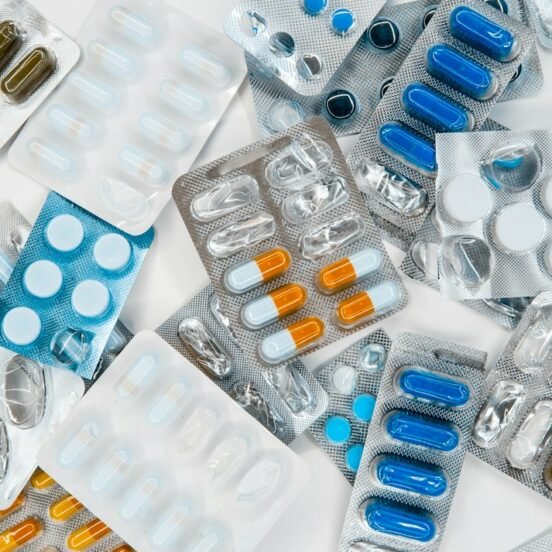 Multiple pharmaceutical blister packs and drug packaging representing the Indian branded-generic medicine market