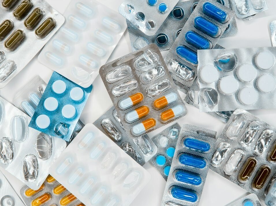Multiple pharmaceutical blister packs and drug packaging representing the Indian branded-generic medicine market