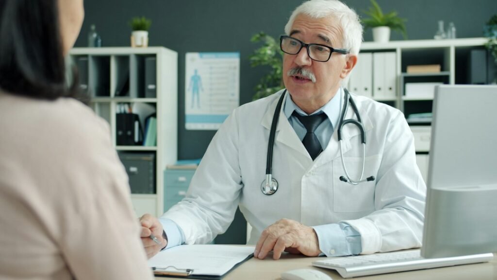 Senior doctor consulting with a patient, illustrating India's growing chronic disease management segment in the pharmaceutical market